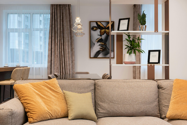 A cozy and well-lit living room featuring a mid-century modern aesthetic.