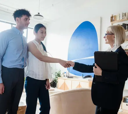 A couple (man and woman) greeting their couples therapy provider.