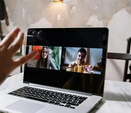 A group of people meeting over a virtual video call.