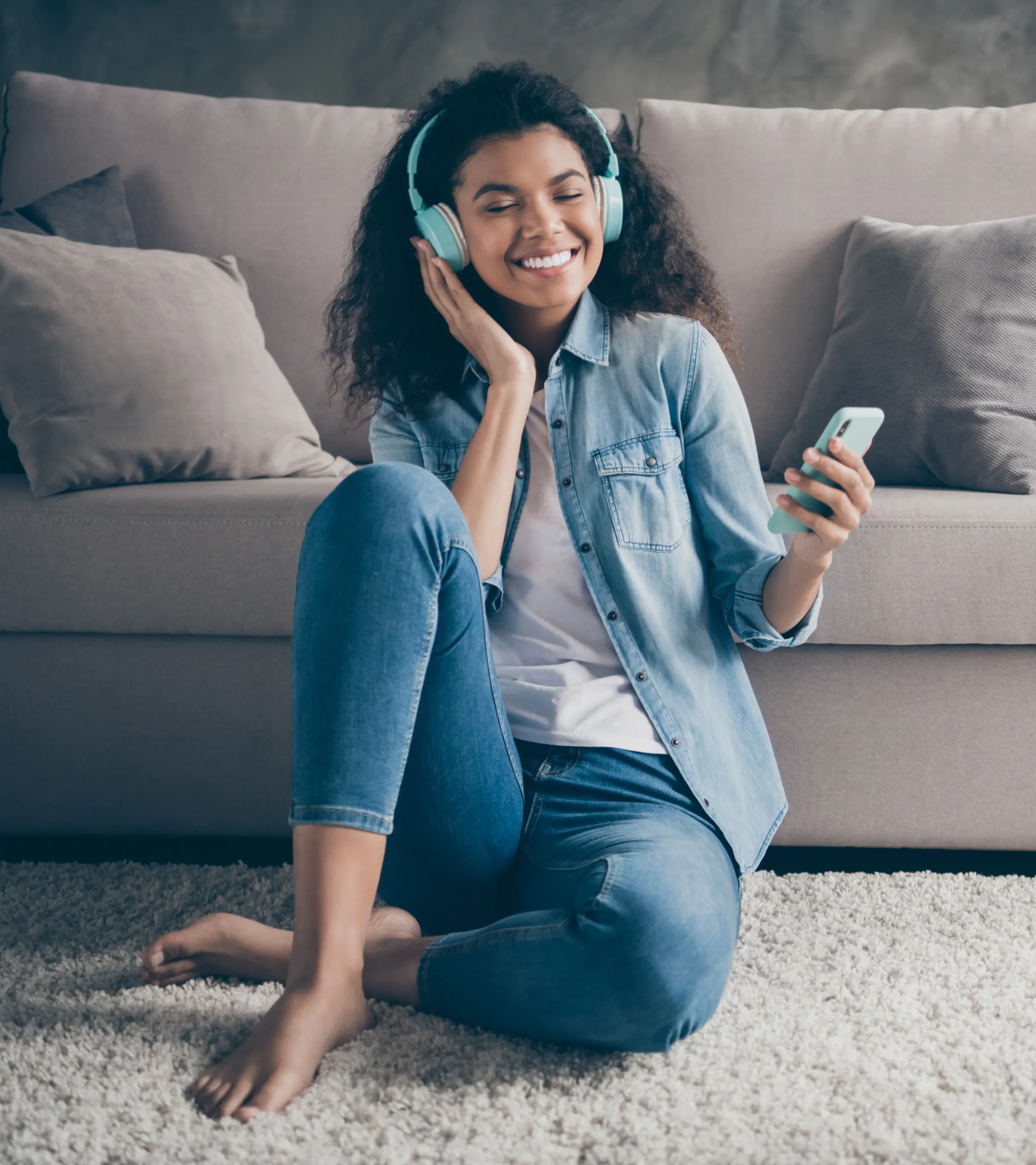 Image of a person lying on a couch at home