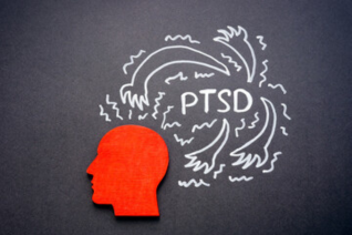 White chalk drawing of swirling storm patterns with 'PTSD' text in center and red circle accent, representing the turbulent mental state and intrusive thoughts characteristic of trauma responses